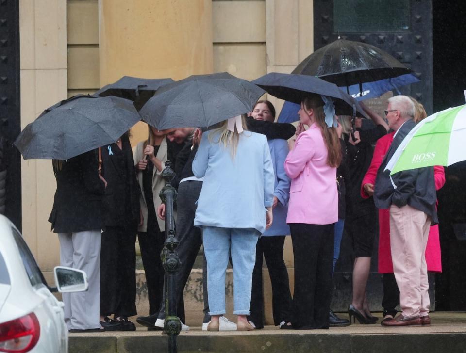 Sharlona Warner is embraced by a supporter outside Durham Crown Court on Tuesday (PA)