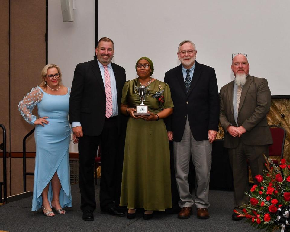 From left, Somerset County Director of Schools Tracie Bartemy, Superintendent of Schools John Gaddis. 2023 Teacher of the Year Tania-Cunningham Raycrow, Board of Education Chairperson William McInturff and Deputy Superintendent Tom Davis.