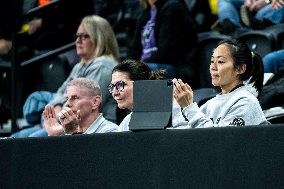 Iowa women's head coach Clarissa Chun, right, watches a match in the finals during the Soldier Salute college wrestling tournament, Friday, Dec. 30, 2022, at Xtream Arena in Coralville, Iowa.