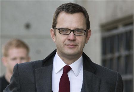 Former News of the World editor Andy Coulson arrives at the Old Bailey courthouse in London November 13, 2013. REUTERS/Neil Hall