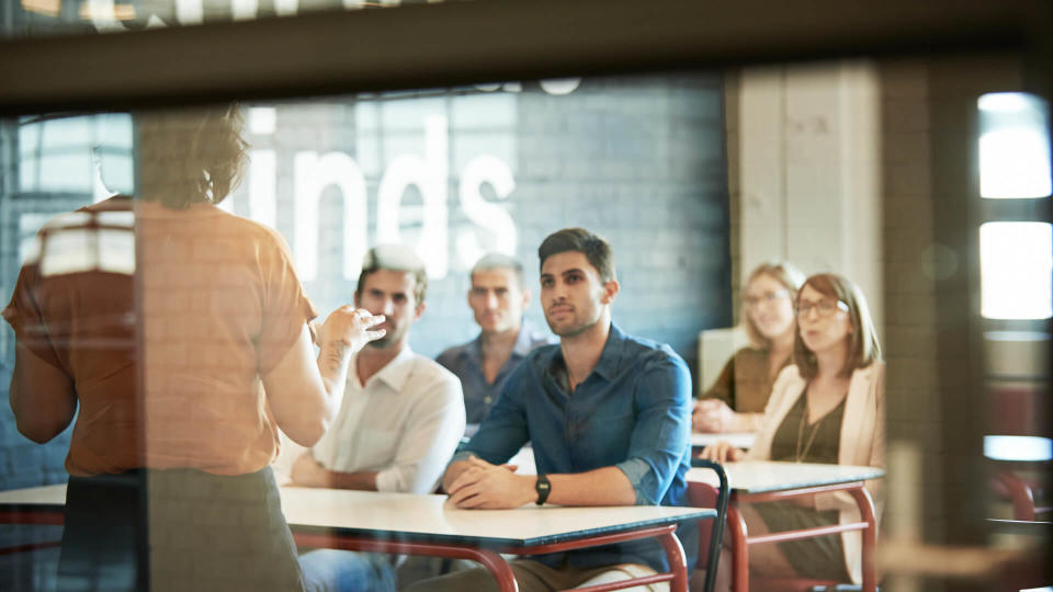 Shot of a group of businesspeople sitting in the boardroom during a presentation.