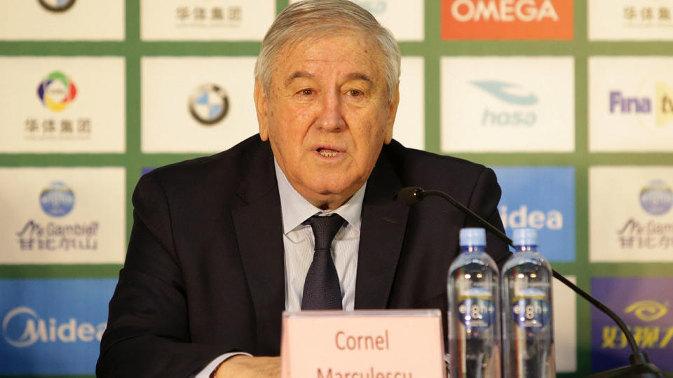 FINA Executive Director Cornel Marculescu speaks at a press conference at the world championships.  (Photo by VCG/VCG via Getty Images)