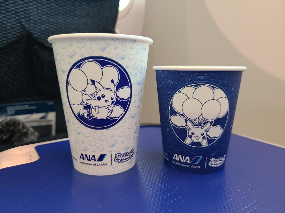 Pokemon illustration on paper cups on flight 