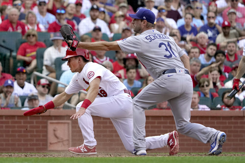 St. Louis Cardinals' Tommy Edman (19) scores past Los Angeles Dodgers starting pitcher Max Scherzer (31) on a passed ball during the sixth inning of a baseball game Monday, Sept. 6, 2021, in St. Louis. (AP Photo/Jeff Roberson)