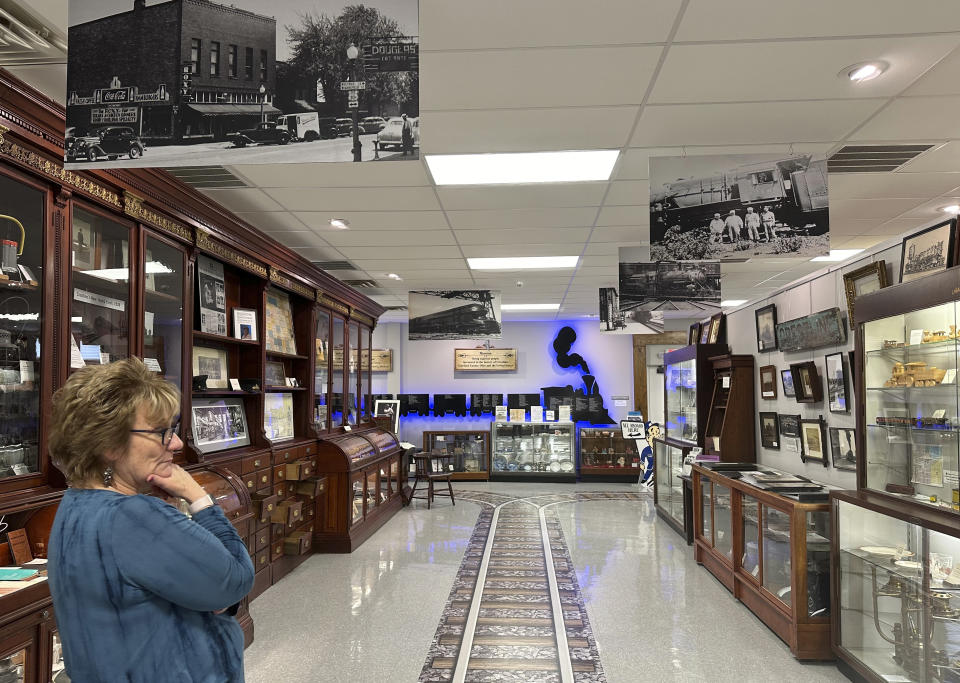 Mayor Linda Horning Pitt stand amid railroad-themed displays at the Crestline Historical Museum in Crestline, Ohio, on Feb. 8, 2024. (AP Photo/Julie Carr Smyth)