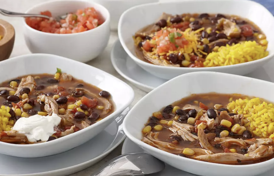 <p>To keep the soup train going, this is for days when you want a flavor-packed, fully loaded chicken enchilada soup but don’t care to stand around stirring. Bust out your <a href="https://bestreviews.com/best-slow-cookers?referrer=yahoo&category=beauty_food&include_utm=1&utm_medium=referral&utm_source=yahoo&utm_campaign=feed" rel="nofollow noopener" target="_blank" data-ylk="slk:slow cooker;elm:context_link;itc:0;sec:content-canvas" class="link ">slow cooker</a> and make this. Along with the chicken, you’ll need corn, black beans, yellow rice, pico de gallo, tortilla chips and a dollop of sour cream on top. </p> <p><a href="https://www.thedailymeal.com/recipes/slow-cooker-chicken-enchilada-soup-recipe?referrer=yahoo&category=beauty_food&include_utm=1&utm_medium=referral&utm_source=yahoo&utm_campaign=feed" rel="nofollow noopener" target="_blank" data-ylk="slk:For the Slow Cooker Chicken Enchilada Soup recipe, click here.;elm:context_link;itc:0;sec:content-canvas" class="link ">For the Slow Cooker Chicken Enchilada Soup recipe, click here. </a></p>