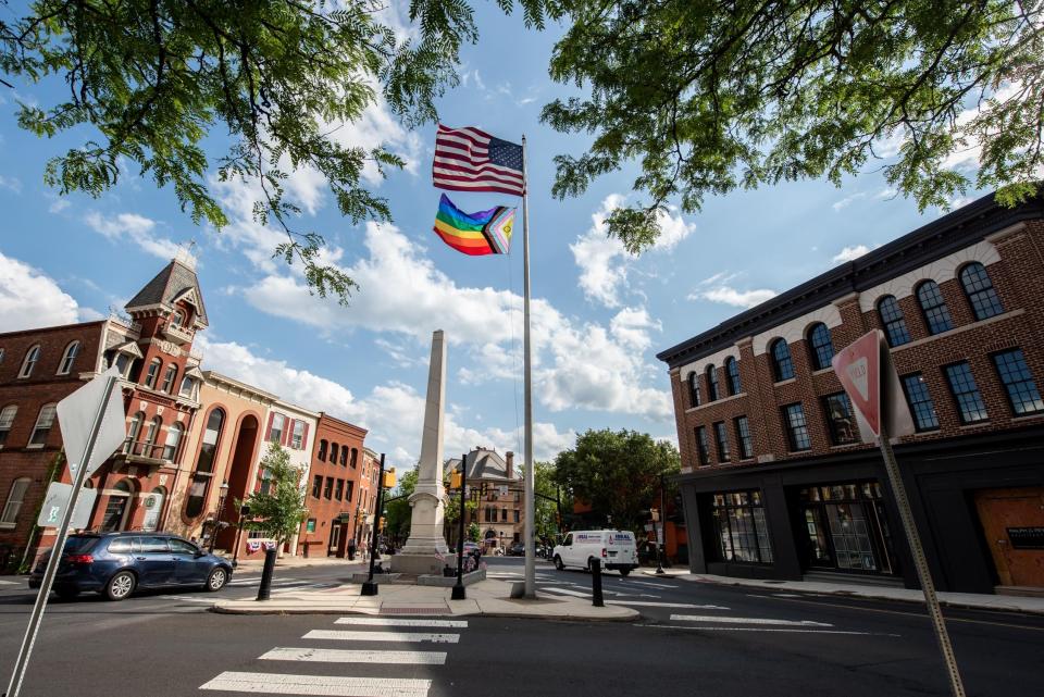 A pride flag, raised in honor of Pride Month, waves from atop a pole in Doylestown Borough on Wednesday, June 14, 2023.