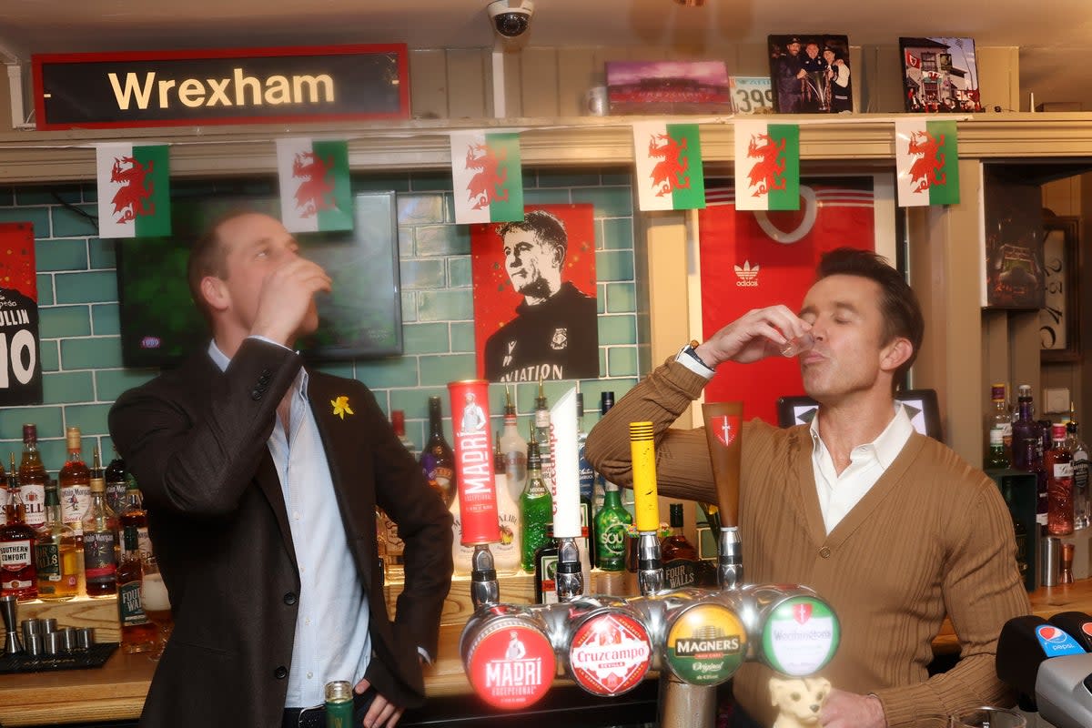 The Prince of Wales and Wrexham chairman Rob McElhenney share a drink (PA)