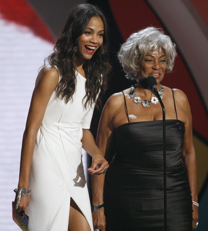 FILE PHOTO: Actresses Zoe Saldana and Nichelle Nichols present the best actress award in Los Angeles