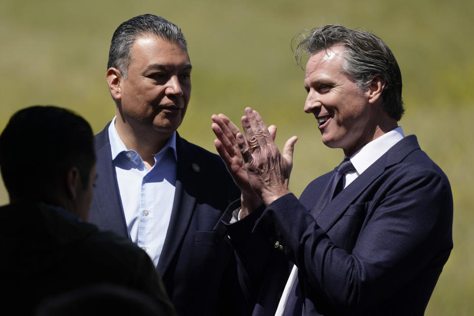 FILE - California Gov. Gavin Newsom, right, talks to Sen. Alex Padilla, D-Calif., during a ground-breaking ceremony for the Wallis Annenberg Wildlife Crossing, Friday, April 22, 2022, in Agoura Hills, Calif. Newsom and Padilla face largely unknown opposition in the June 7, 2022, primary election. (AP Photo/Marcio Jose Sanchez, File)