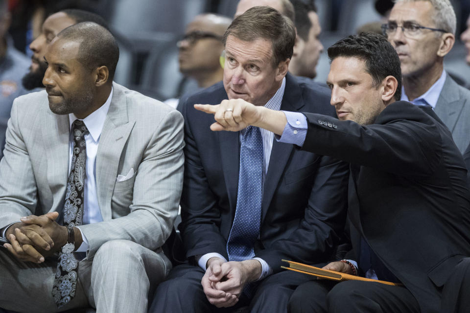 (From left to right) David Vanterpool, Terry Stotts and Nate Tibbets keep a close eye on the Blazers during an October game. (AP)