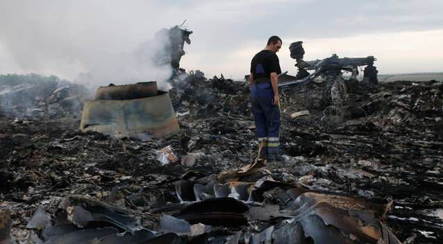 An Emergencies Ministry member walks at the site of the plane crash near the settlement of Grabovo in the Donetsk region. Photo: Reuters