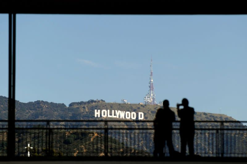 People take photos of the Hollywood sign February 23, 2013. On April 4, In 1850, the city of Los Angeles was incorporated. File Photo by Kevin Dietsch/UPI