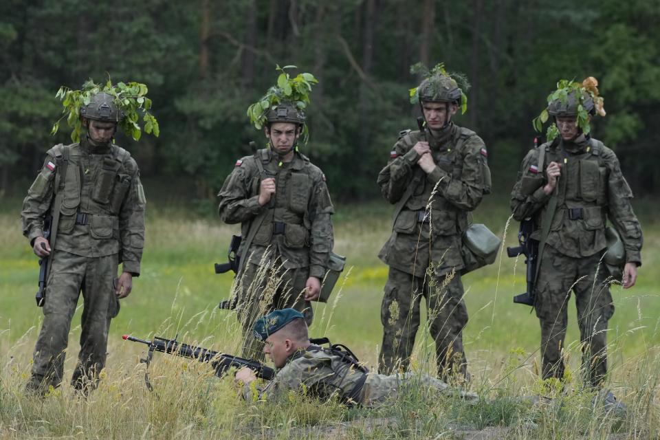 Volunteers in Poland's army practice shooting during training exercises in Nowogrod, Poland, on Thursday June 20, 2024. Poland’s army has launched a program this summer called “Holidays with the Army” to train young volunteers in combat. Nations along NATO’s eastern flank are strengthening their defenses while fearing that Russia could one day attack them if it prevails in neighboring Ukraine. (AP Photo/Czarek Sokolowski)