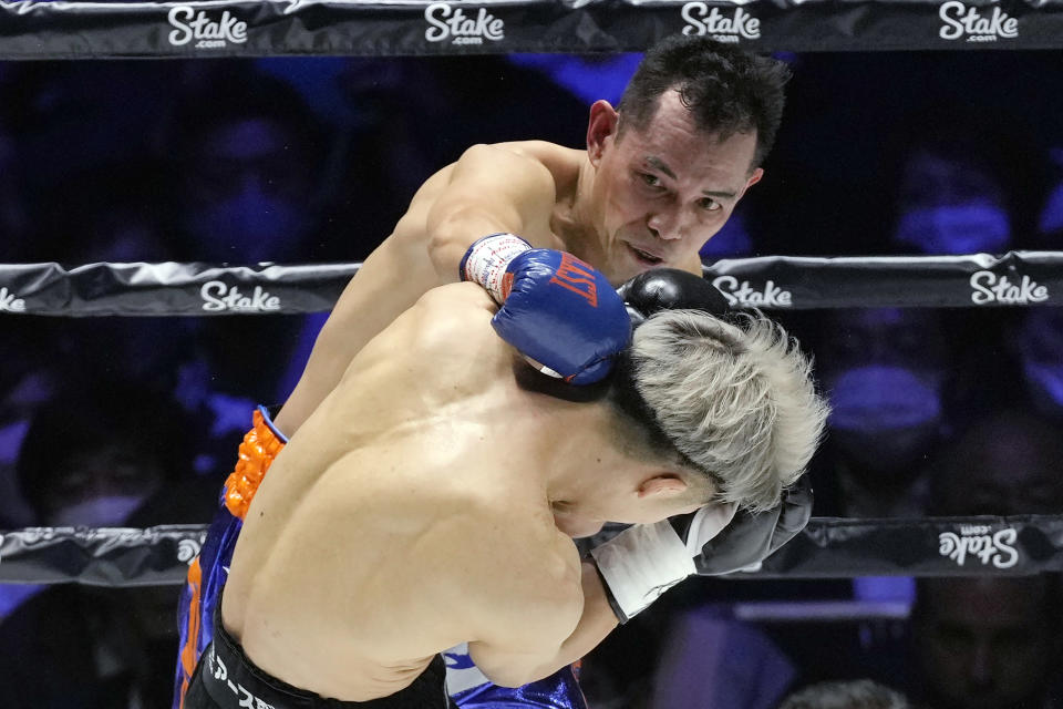 Philippines' Nonito Donaire fights in his bout against Japan's Naoya Inoue in their bantamweight title unification boxing match of WBA, WBC and IBF in Saitama, north of Tokyo, Tuesday, June 7, 2022. (AP Photo/Hiro Komae)