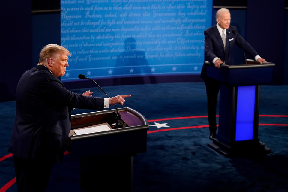 U.S. President Donald Trump and Democratic presidential nominee Joe Biden participate in their first 2020 presidential campaign debate held on the campus of the Cleveland Clinic at Case Western Reserve University in Cleveland, Ohio, U.S., September 29, 2020. Morry Gash/Pool via REUTERS