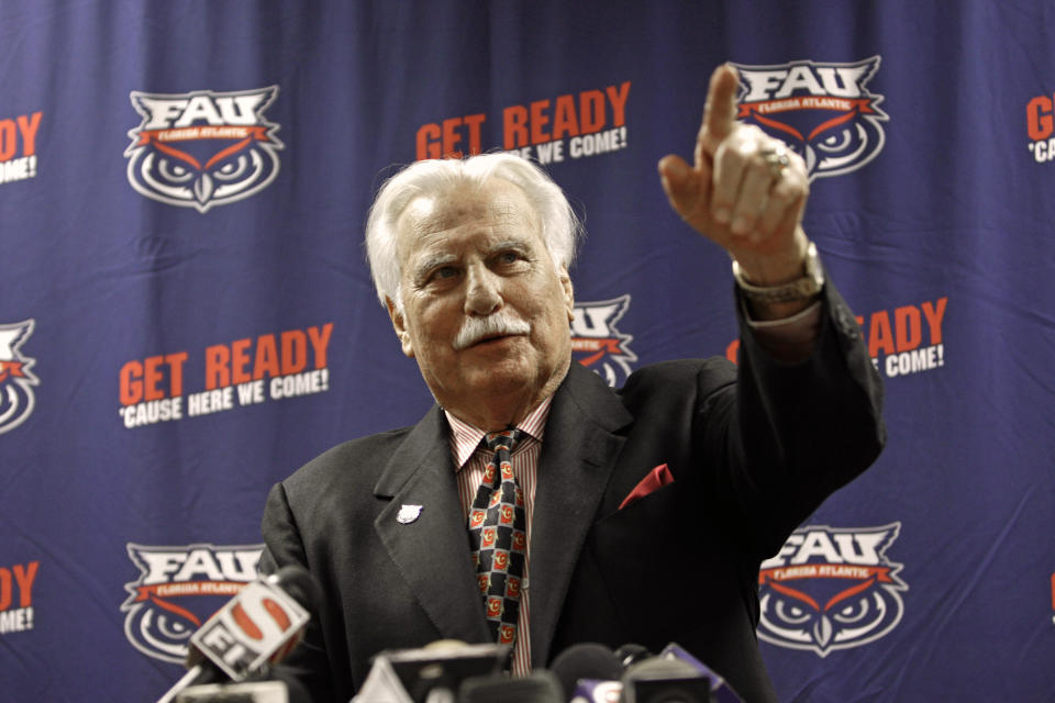 In this Aug. 11, 2011 photo, Howard Schnellenberger speaks during his announcement that he will retire from coaching after the 2011 season with Florida Atlantic University during a news conference in Boca Raton, Fla. Schnellenberger, who coached Miami to the 1983 national championship and built programs at Louisville and Florida Atlantic, died Saturday, March 27, 2021 at the age of 87, Florida Atlantic announced. (AP Photo/J Pat Carter)