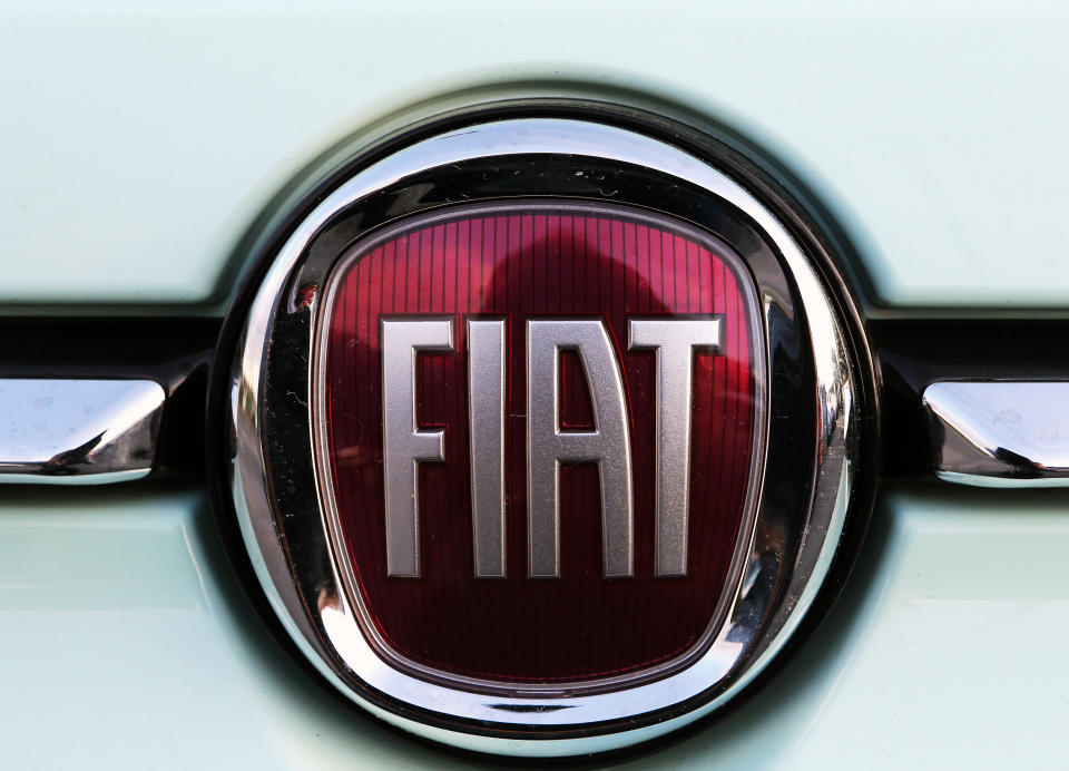 A Fiat logo pictured on a car in Bayonne, southwestern France, Thursday, Oct.31, 2019.The boards of Fiat Chrysler and PSA Peugeot announced Thursday fast-moving plans to merge the two companies creating the world's fourth-largest automaker with enough scale to confront "the new era in mobility". (AP Photo/Bob Edme)