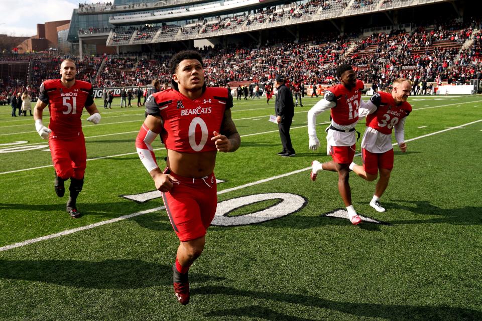 Cincinnati Bearcats linebacker Ivan Pace Jr. (0) jogs back to the locker room after pregame ceremonies recognizing seniors on the roster before the first quarter quarter during a college football game against the Tulane Green Wave, Friday, Nov. 25, 2022, at Nippert Stadium in Cincinnati. 