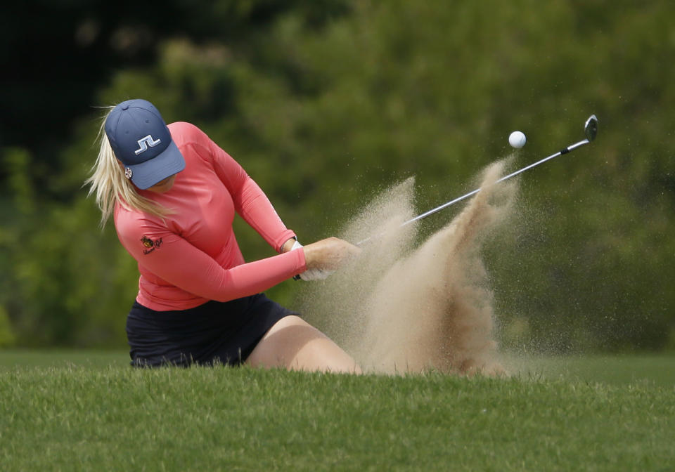 Matilda Castren, of Finland, plays a shot out of a fairway bunker on the 12th hole during the final round of the LPGA Volunteers of America Classic golf tournament in The Colony, Texas, Sunday, July 4, 2021. (AP Photo/Ray Carlin)