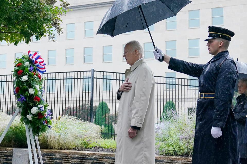 President Joe Biden participates in a wreath laying ceremony while visiting the Pentagon in Washington, Sunday, Sept. 11, 2022, to honor and remember the victims of the September 11th terror attack.