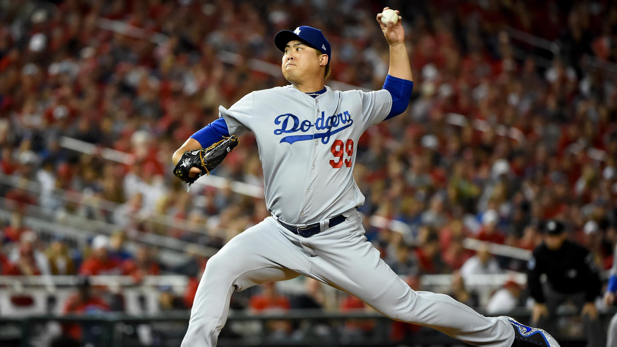 Toronto Blue Jays newly signed pitcher Hyun-Jin Ryu, right, holds