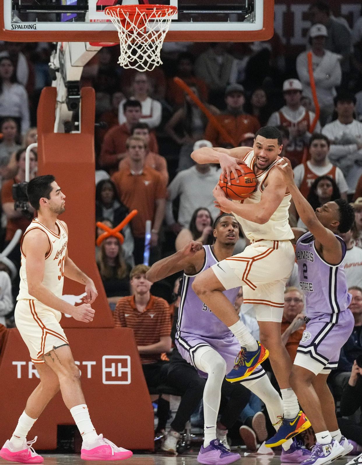Texas forward Dylan Disu fights for a rebound in Monday's win over Kansas State. The Longhorns will keep fighting for a better NCAA Tournament seed with Saturday's trip to Kansas. Prognosticators are currently predicting a No. 8 or No. 9 seed for the Longhorns.