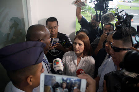 Marta de Martinelli, wife of former Panama president Ricardo Martinelli, speaks to an official while waiting for his extradition from U.S. outside the Panama Pacifico international airport in Panama City, Panama June 11, 2018. REUTERS/Carlos Lemos