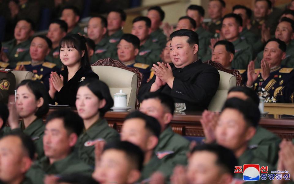 Kim Jong-un and his daughter at a concerto performance after a visit with the 1st Air Force Division Flying Regiment