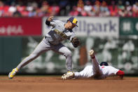 St. Louis Cardinals' Michael Siani is safe at second for a stolen base ahead of the tag from Milwaukee Brewers shortstop Willy Adames, left, during the second inning of a baseball game Sunday, April 21, 2024, in St. Louis. (AP Photo/Jeff Roberson)