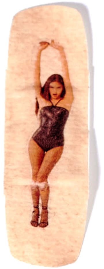 Picture of a small bandage with an image of Olivia Rodrigo wearing a black bodysuit and dancing with arms stretched above her head printed on the bandage.