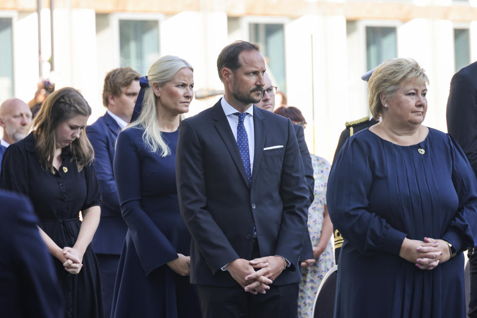 Norway's Crown Prince Haakon Magnus, centre, Crown Princess Mette-Marit, centre left and Prime Minister Erna Solberg, right, attend a memorial service marking the 10-year anniversary of the terrorist attack by Anders Breivik, in the Government Quarter, Oslo, Thursday, July 22, 2021. Commemorations will be held marking the 10-year anniversary of Norway’s worst ever peacetime slaughter. On July 22, 2011, rightwing terrorist Anders Breivik set of a bomb in the capital, Oslo, killing eight people, before heading to tiny Utoya island where he stalked and shot dead 69 mostly teen members of the Labor Party youth wing. (Geir Olsen/NTB scanpix via AP)