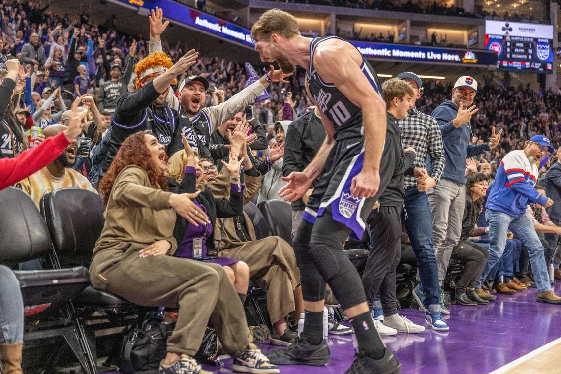 Sacramento Kings forward Domantas Sabonis (10) celebrates with Reece Fox, the wife of Kings guard De’Aaron Fox, a lead-changing three-point basket at the end of the third quarter against the Detroit Pistons on Feb. 7. The team would collapse in the fourth quarter.