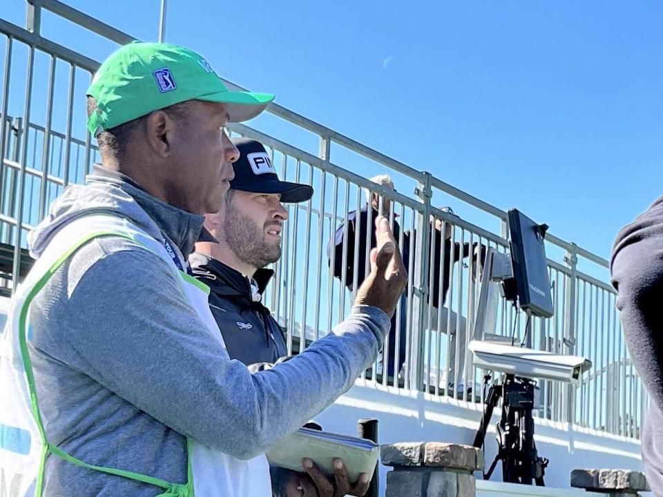 Ponte Vedra Beach resident David Lingmerth (center) gets wind direction from caddie Cedric Lamar at the first hole of the Sea Island Club Seaside Course on Friday during the second round of the RSM Classic. Lingmerth is continuing a comeback with rounds of 67-65.