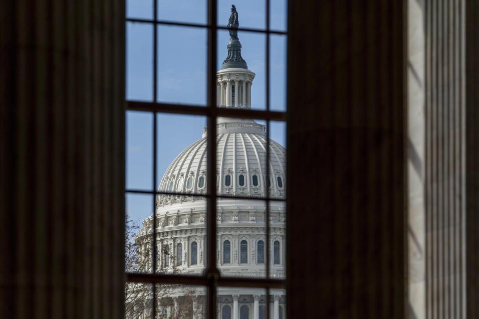 The Capitol is framed through a window in the Russell Senate Office Building in Washington, D.C.