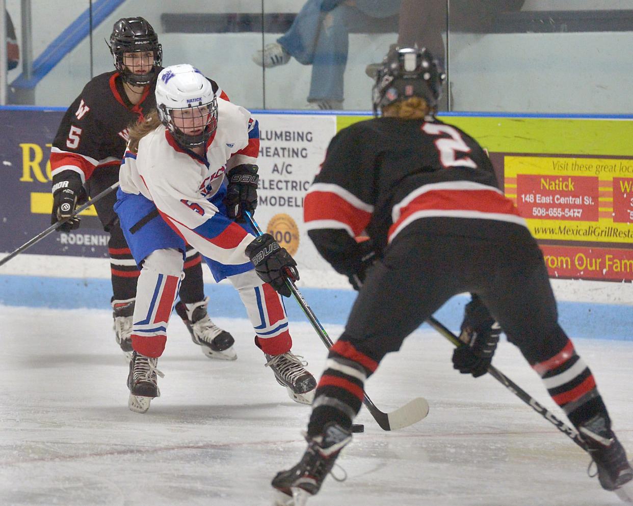 Natick High School freshman Maggie Connors makes a move against Wellesley at Chase Arena, Feb. 16, 2022.