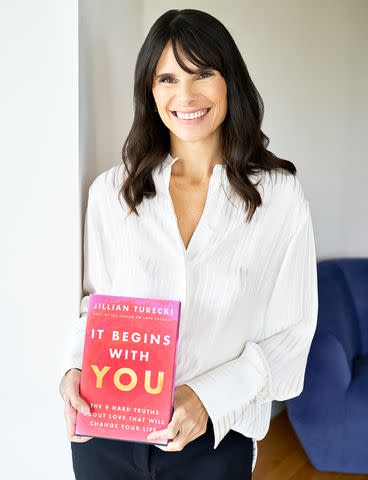 <p>Lex Merico</p> Jillian Turecki with her book 'It Begins With You'