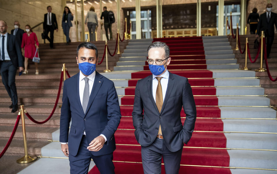 German Foreign Minister Heiko Maas, right, and his Italian counterpart Luigi Di Maio wear face masks to protect against the coronavirus during a meeting in Berlin, Germany, Friday, June 5, 2020. (Michael Kappeler/Pool via AP)