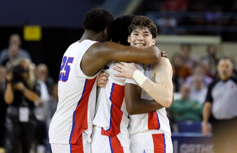 OCS' Carson Jones (24) celebrates with teammates during the class 4A boys state championship basketball game between OCS and Millwood at the State Fair Arena in Oklahoma City, Saturday, March 9, 2024.