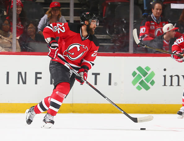 NEWARK, NJ - FEBRUARY 21: Kyle Quincey #22 of the New Jersey Devils plays the puck against the Ottawa Senators during the game at Prudential Center on February 21, 2017 in Newark, New Jersey. (Photo by Andy Marlin/NHLI via Getty Images)