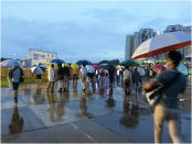 People start arriving for the Reform Party's rally.