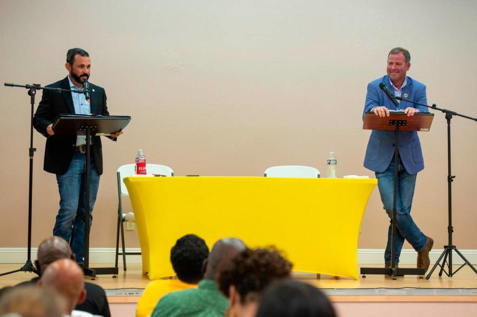 Louis Elias, left, and Matt Haley, right, candidates for Harrison County sheriff, answer questions during a debate moderated by Rip Daniels at Saint Paul United Methodist church in Biloxi on Tuesday, June 27, 2023.