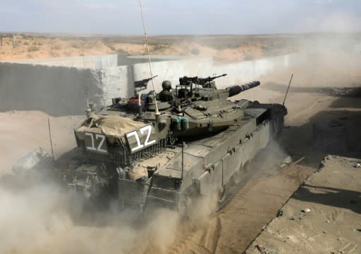 Israeli soldiers train in a tank during an exercise at the Tzeelim army base on July 3, 2018, weeks before the army said it carried out artillery strikes against seven military targets belonging to Hamas on July 25