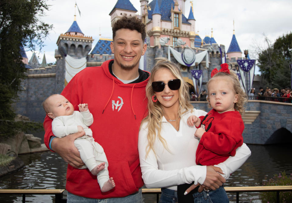 Making the traditional Super Bowl MVP's trip to Disneyland, Patrick Mahomes and his wife Brittney pose in front of Sleeping Beauty Castle with their children, Sterling, 1, and Bronze, 11 weeks.