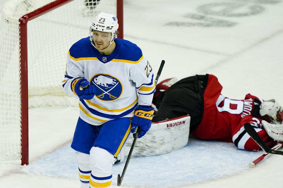 Buffalo Sabres center Sam Reinhart (23) reacts after he scores on New Jersey Devils goaltender Mackenzie Blackwood (29) for a second time in the second period of an NHL hockey game, Saturday, Feb. 20, 2021, in Newark, N.J. (AP Photo/John Minchillo)