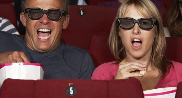 Couple Watching 3D Film In Cinema