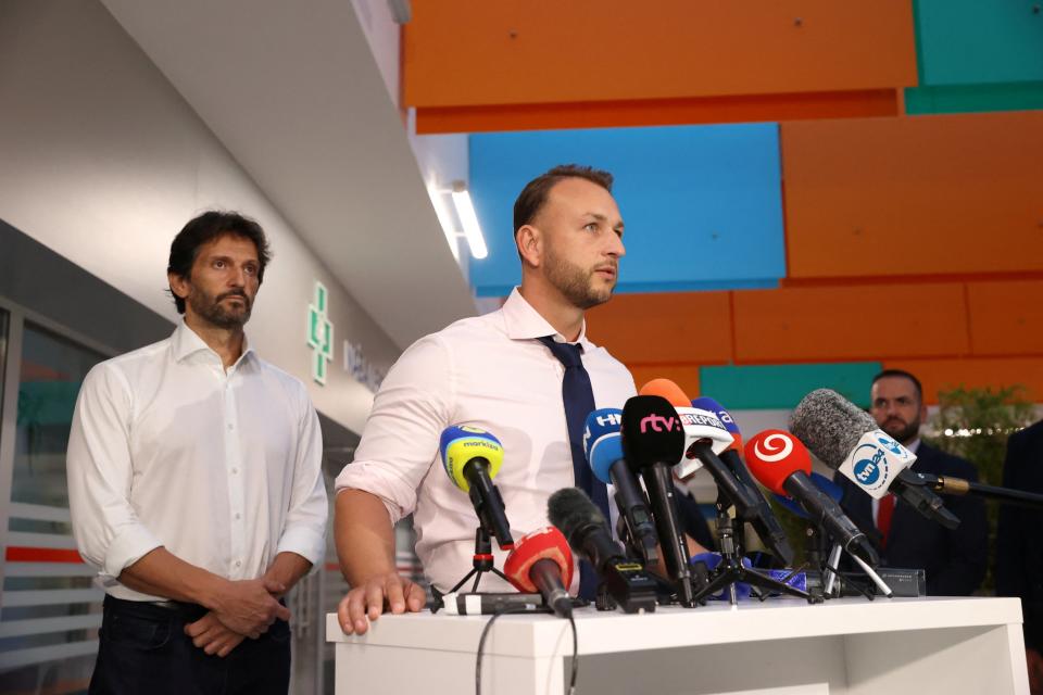 Slovak Interior Minister Matus Sutaj Estok, flanked by Defence Minister Robert Kalinak, speaks during a press conference (REUTERS)