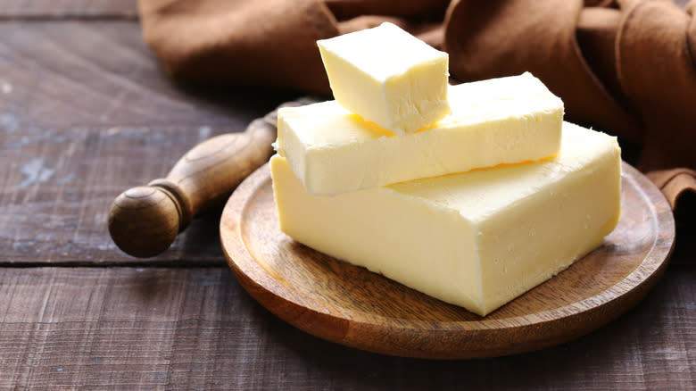 butter blocks on wooden plate