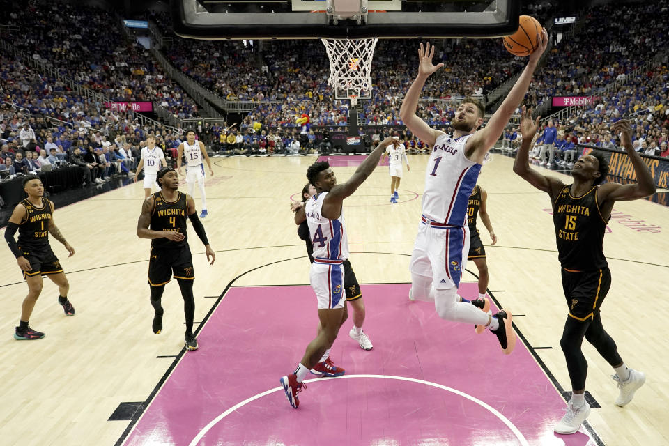 Kansas center Hunter Dickinson (1) shoots during the first half of an NCAA college basketball game against Wichita State Saturday, Dec. 30, 2023, in Kansas City, Mo. (AP Photo/Charlie Riedel)