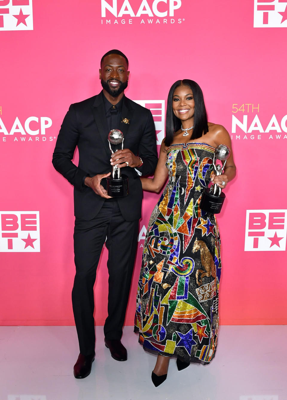 Honorees Dwyane Wade and Gabrielle Union, recipients of the President's Award, pose in the press room during the 54th NAACP Image Awards at Pasadena Civic Auditorium on February 25, 2023 in Pasadena, California. (Aaron J. Thornton / Getty Images)